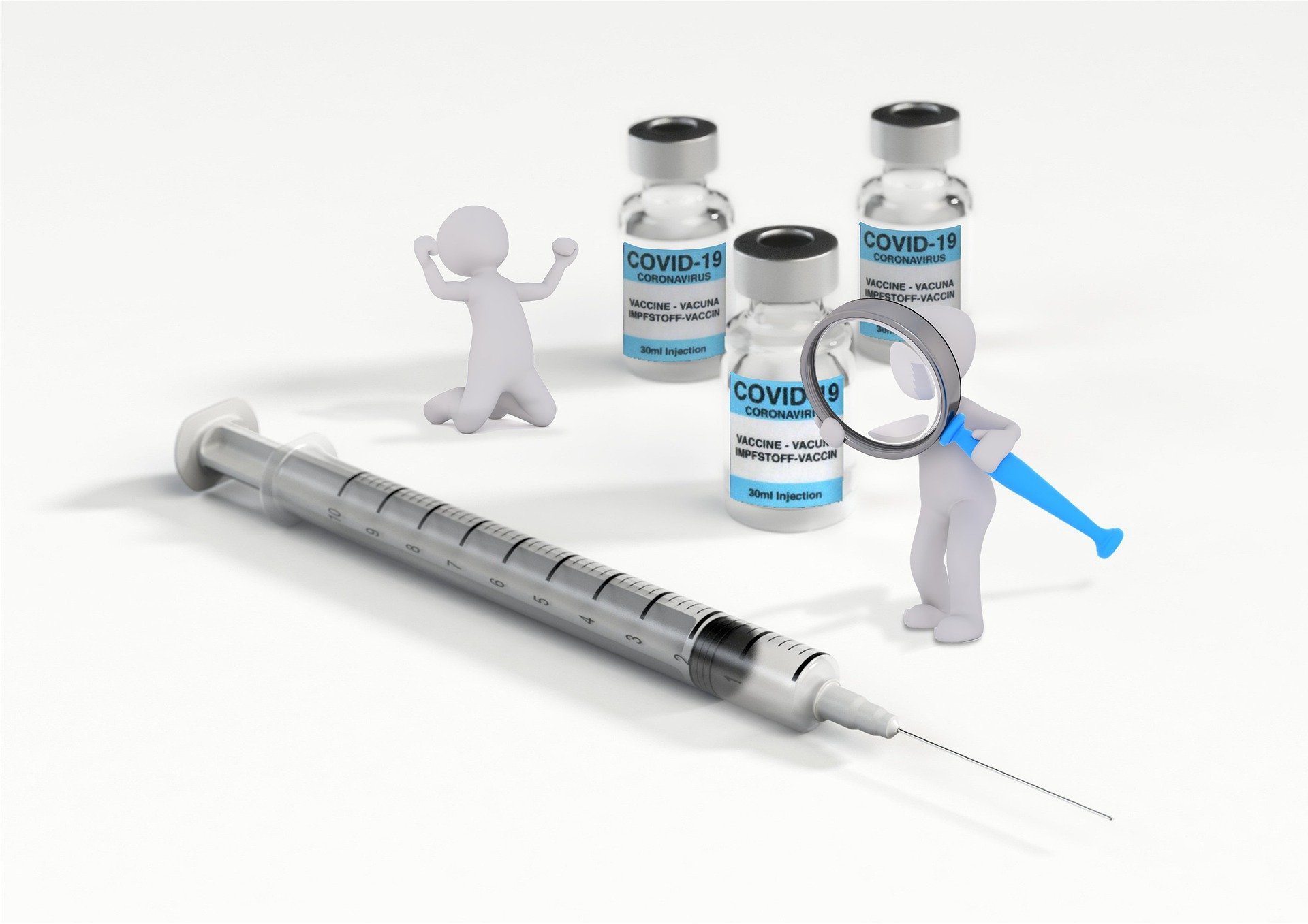 strzykawka i trzy fiolki ze szczepionką